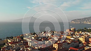 Beautiful panoramic aerial view on the center of Sorrento city, sunset, houses and streets, sea views and a Vizuvius, Napoli in th