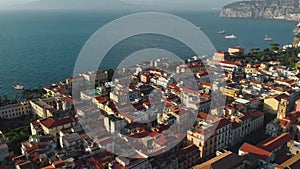 Beautiful panoramic aerial view on the center of Sorrento city, sunset, houses and streets, sea views and a Vizuvius, Napoli in th