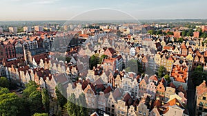 Beautiful panoramic architecture of old town in Gdansk, Poland at sunrise. Aerial view drone pov. Landscape cityscape