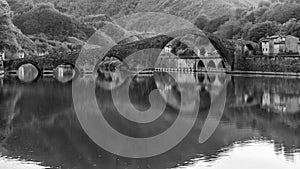 Beautiful panoramic black and white view of Ponte della Maddalena, Devil`s bridge, Borgo a Mozzano, Lucca, Tuscany, Italy