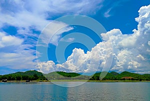 Beautiful panoramic landscape of clouds over mountain and lake with blue sky  Blue cloudy background  pontoon on the lake -