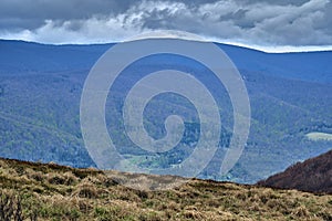 A beautiful panoramic mysterious view of the forest in the Bieszczady mountains Poland on a misty rainy spring May day, nature