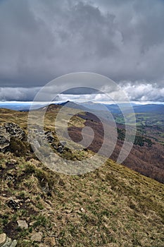 A beautiful panoramic mysterious view of the forest in the Bieszczady mountains Poland on a misty rainy spring May day, nature