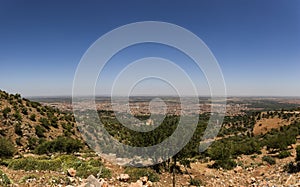 Beautiful panoramic photo of the moroccan city of Beni Melal seen from the height of the middle atlas and the tadla plain photo