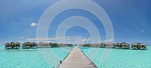 Beautiful panoramic photo of over water bungalows at Maldives