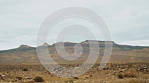 Beautiful panoramic rocky landscape, Stones and rocks in a color canyon in Morocco, cloudy sky, full hd