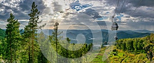 Beautiful panoramic shot of cableway over a forest