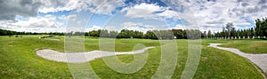 Beautiful panoramic shot of golf course at sunny day