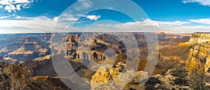 Beautiful panoramic shot of landscape of the Grand Canyon under a blue sky at sunset