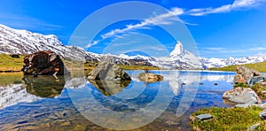 Beautiful panoramic summer view of the Stellisee lake with reflection of the iconic Matterhorn