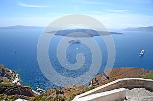 Beautiful panoramic view on Aegean sea with cruise boats and several islands, Santorini, Greece