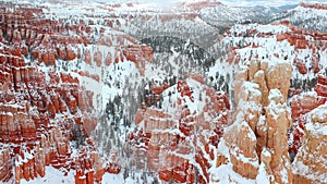 Beautiful panoramic view of Bryce canyon Nationalpark with snow in Winter with red rocks / Utah / USA photo