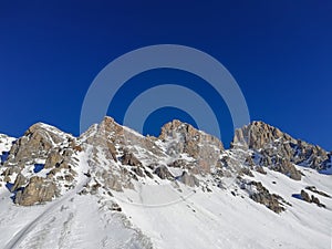 Beautiful panoramic view of the Cima Uomo group in the Dolomites at Pass San Pellegrino and the ski slopes photo