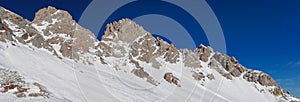 Beautiful panoramic view of the Cima Uomo group in the Dolomites at Pass San Pellegrino and the ski slopes photo