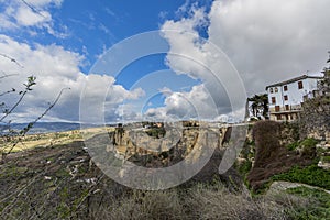 Beautiful panoramic view of the city of Ronda over the mountain with its valley with farmland