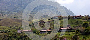 Beautiful panoramic view of houses in the mountains in Costa Rica with green jungle