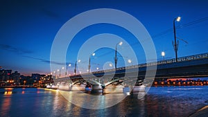 Beautiful panoramic view at illuminated Voronezh city bridge in blue hour after sunset