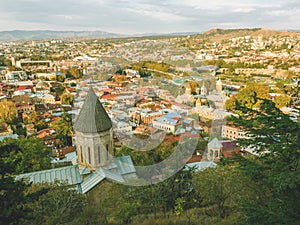 Beautiful panoramic view from the mountain to Old Town Tbilisi in autumn at sunset. Georgia