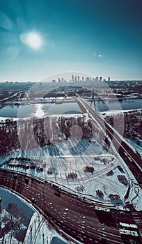 Beautiful panoramic winter aerial drone view to Warsaw city center with skyscrapers and Swietokrzyski Bridge En: Holy Cross