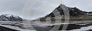 Beautiful panoramic winter landscape view of Iceland, snow capped on the mountains.