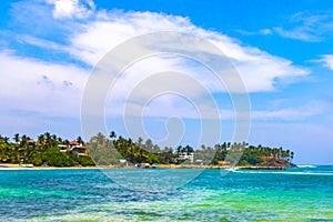 Beautiful paradise tropical beach waves palms Mirissa Beach Sri Lanka