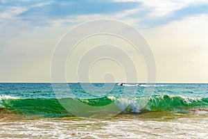 Beautiful paradise tropical beach waves palms Mirissa Beach Sri Lanka