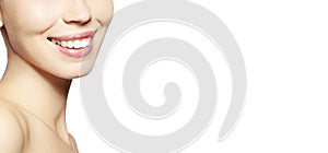 Beautiful Part Face Young Woman with White Teeth on White Background. Happy Smile. Wellness and Tooth Care. Copy Space