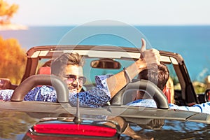 Beautiful party friend girls dancing in a car on the beach happy