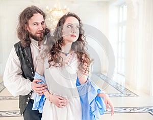 Beautiful passionate couple woman and man in medieval clothes