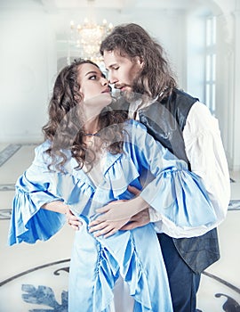 Beautiful passionate couple woman and man in medieval clothes