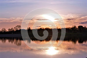 Beautiful pastel sunset on the lake horizon