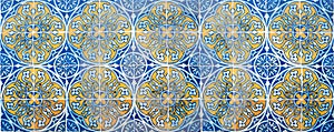 Beautiful pattern of azulejos tiles at historic house facade lissabon, blue and yellow colored photo