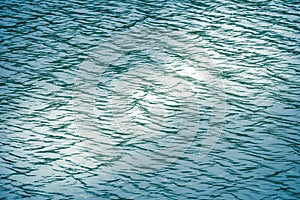 Beautiful pattern of blue water reflecting the sun.