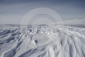 Beautiful patterns of sastrugi, parallel wavelike ridges caused by winds on surface of hard snow