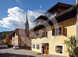 Beautiful paved street with old residential houses and gothic pa