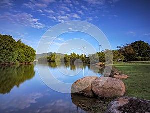 A beautiful and peaceful lakeside park view on a weekend morning