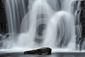 Beautiful peaceful landscape image of Aysgarth Falls in Yorkshire Dales in England during Winter morning