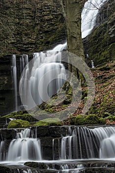 Beautiful peaceful landscape image of Scaleber Force waterfall in Yorkshire Dales in England during Winter morning