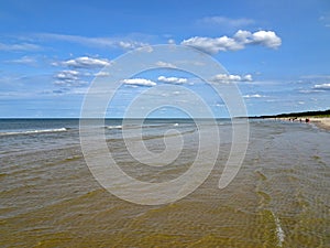 Beautiful peaceful sea under a cloudy sky in Leba, Poland