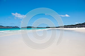 Beautiful peaceful serene scene of vast white sandy beach in Hamilton Island Queensland Australia in Sunny day