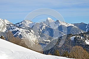 Beautiful peaceful winter landscape in the Frence Alps, at one of the ski stations, France. The view on the empty ski slopes