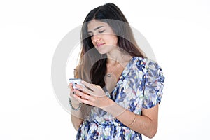 Beautiful pensive woman looks dreamily at her cup of coffee