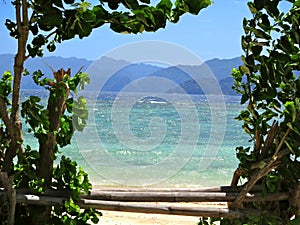 Beautiful Philippine Beach photographed through natural frame