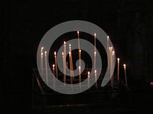 Beautiful photo of candles in a church lit for the feeling photo