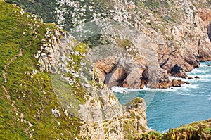 Beautiful photo depicting rocks, sea and vegetation