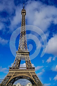 Beautiful photo of the Eiffel tower in Paris with gorgeous colors and wide angle central perspective photo