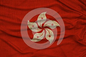 Beautiful photo of the national flag of Macau on delicate shiny silk with soft draperies, the concept of state power, country life