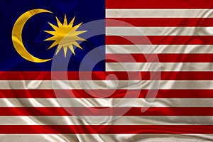 Beautiful photo of the national flag of Malaysia on delicate shiny silk with soft draperies, the concept of state power, country