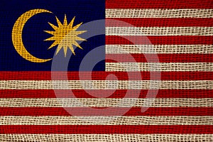 Beautiful photo of the national flag of Malaysia on delicate shiny silk with soft draperies, the concept of state power, country