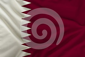 Beautiful photo of the Qatar national flag on delicate shiny silk with soft draperies, the concept of state power, country life,